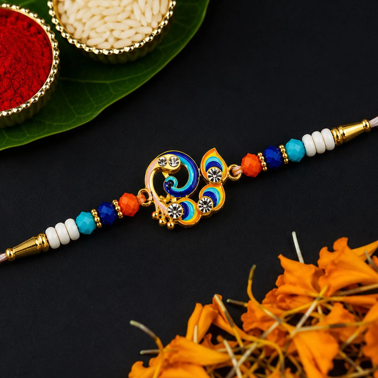 Peacock Feather Rakhi – Golden Enamel Pearl Beads