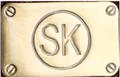 S. K. Trader logo